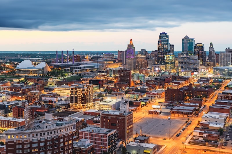 Kansas City skyline in Missouri at dusk with city lights and buildings