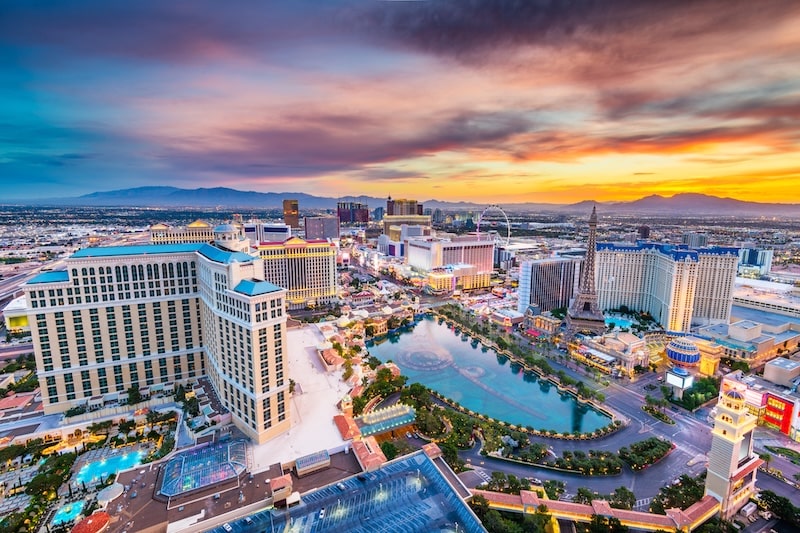 Aerial view of the Las Vegas Strip at sunset, showcasing iconic casinos and hotels in Nevada.