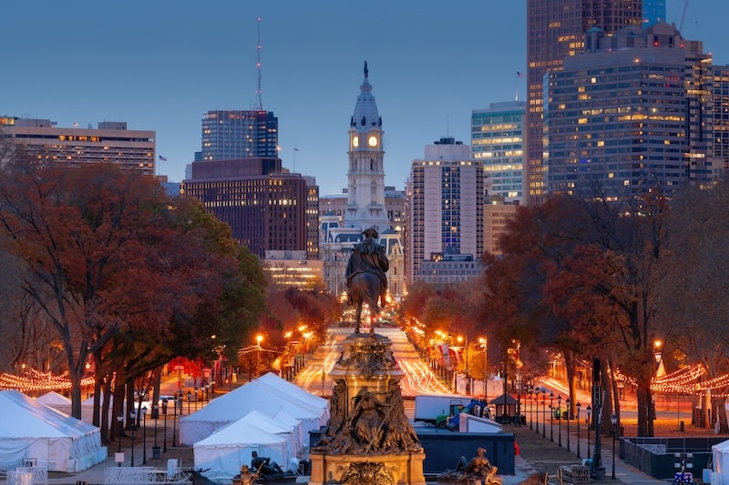 View of Philadelphia skyline from the Benjamin Franklin Parkway with City Hall in the distance.